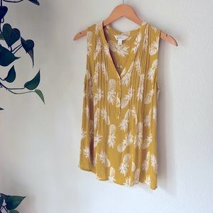 Yellow women’s size large sleeveless top.